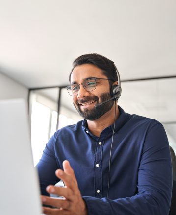 Smiling,Indian,Call,Center,Agent,Wearing,Headset,Talking,To,Client Smiling,Indian,Call,Center,Agent,Wearing,Headset,Talking,To,Client